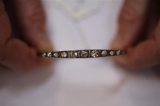 An Edwardian gold, silver and diamond hinged bangle,